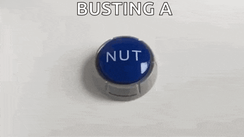 a blue button that says `` busting a nut '' is on a white surface .