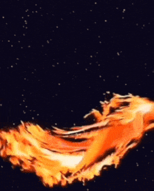 a large fire is burning in the dark and looks like a bomb explosion .