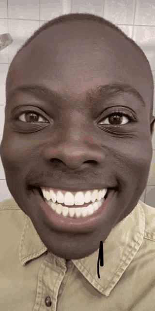 a close up of a man 's face with a smiley face