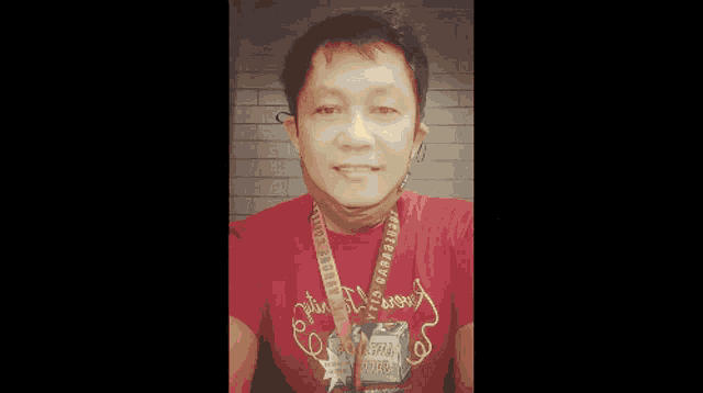 a man in a red shirt with the name willy jancian on the bottom right