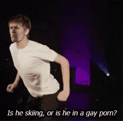 a man in a white shirt is dancing and asking if he is skiing or is he in a gay porn .