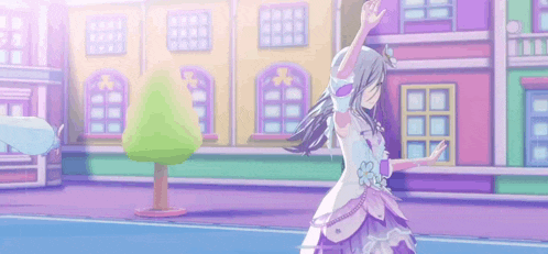 a man and a girl are dancing in front of a colorful building .