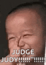 a baby is making a funny face and laughing with the words `` judge judy ! ''