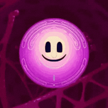 a purple circle with a face on it is laughing and looking at the camera .