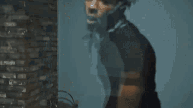 a man is dancing in front of a television in a living room
