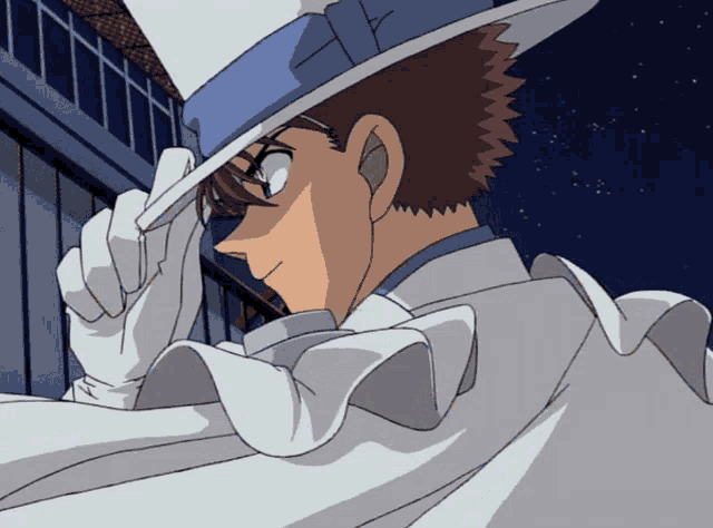 a man in a blue hat and white gloves