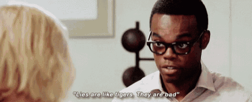 a man with glasses is talking to a woman and saying lies are like tigers they are bad .