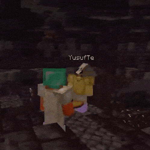 two minecraft characters are standing next to each other on a rock in a dark room .