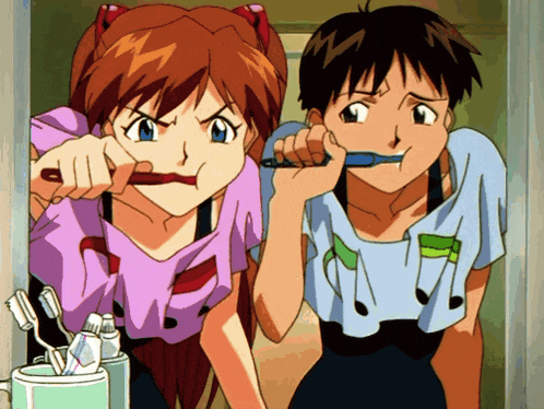 a boy and a girl brushing their teeth together in a bathroom