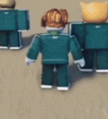 a group of roblox figures are standing next to each other on a sandy surface .