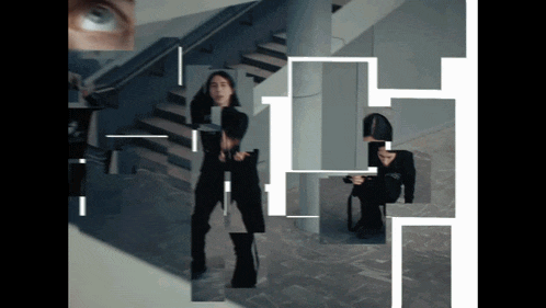 a woman is standing in front of a staircase surrounded by a maze