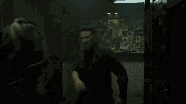 a blurry picture of a person walking down a hallway