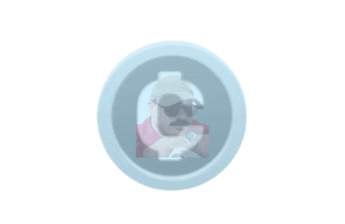a man wearing sunglasses and a hat is visible through a hole in a circle