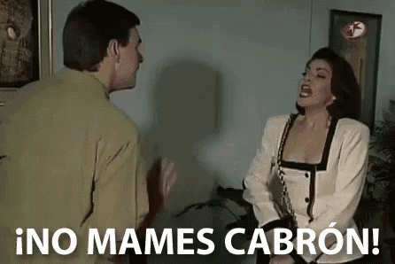a man and a woman are having a fight in a living room and the woman is yelling at the man .