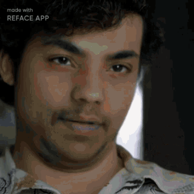a close up of a man 's face with the words made with reface app below it
