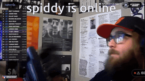 a man wearing glasses and a hat says " spiddy is online "