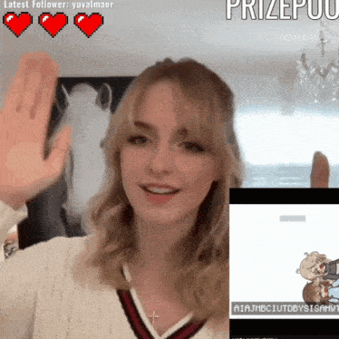 a woman is waving her hand in front of a screen that says prizepuu