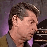 a man talking into a microphone with a sign behind him that says royf on it