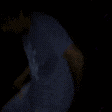 a blurry picture of a person with a shield on their chest