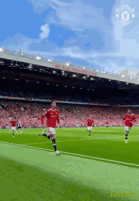 soccer players on a field with a noxwin logo on the bottom right