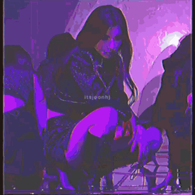 a pixelated image of a woman in a red jacket with a chain around her waist