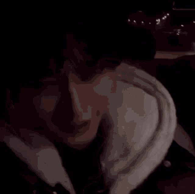 a close up of a person 's face with a hoodie on .