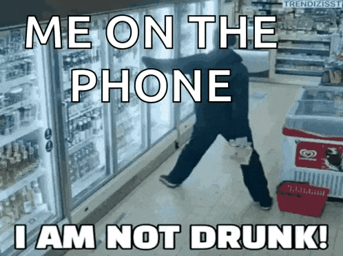 a man is standing in front of a refrigerator with the words me on the phone i am not drunk on the bottom