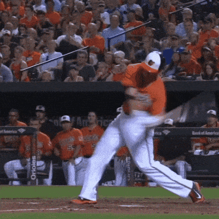 a baseball player is swinging his bat at a pitch during a game
