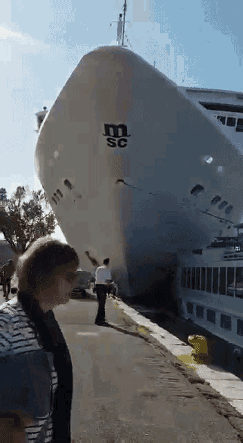 a large cruise ship with the letter m on the side of it