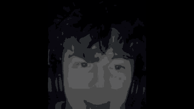 a blurred image of a man 's face with the words horny simp below it