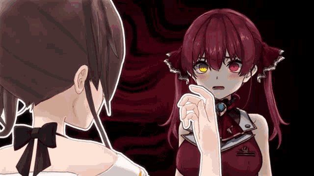 a girl with red hair is looking at another girl with brown hair