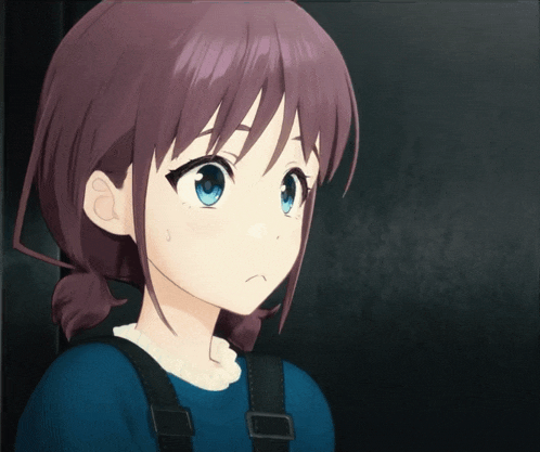 a girl with brown hair and blue eyes is wearing a blue shirt and black suspenders