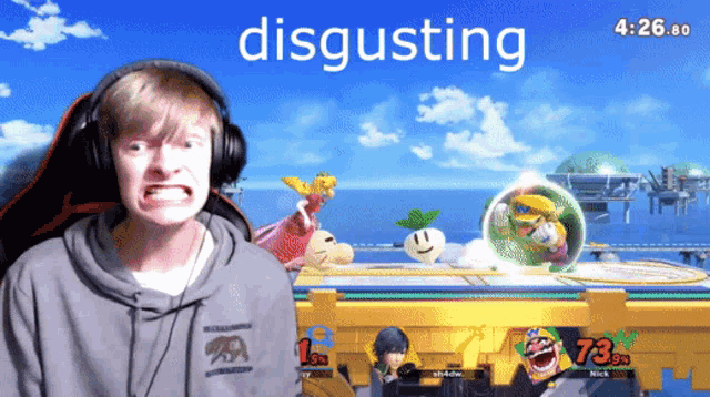 a man wearing headphones is playing a video game with the word disgusting in the background