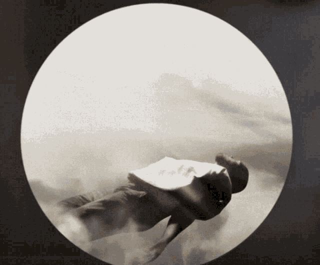 a person is flying through a circle in the air