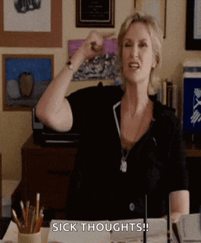a woman in a black shirt is pointing at her head and says sick thoughts !
