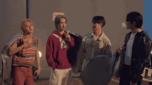 a group of young men are standing next to each other and one of them is saying as for you