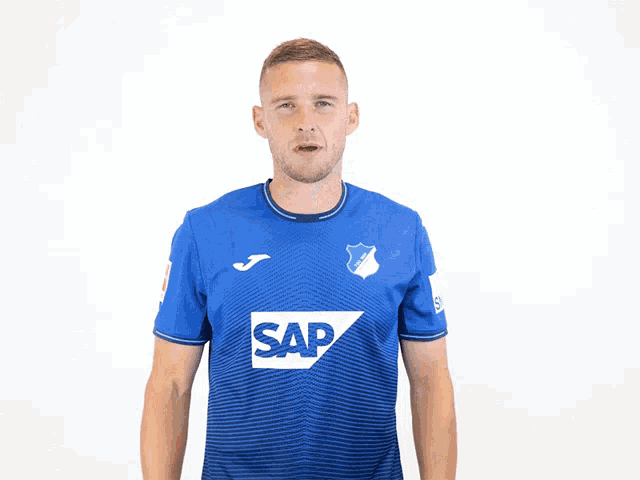 a man is wearing a blue shirt with the word sap on it
