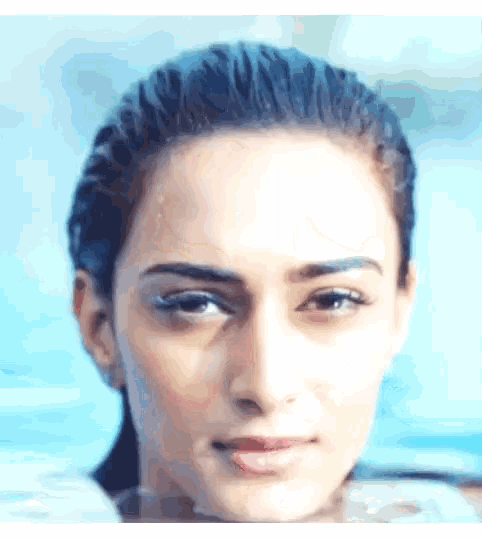 a close up of a woman 's face in a pool