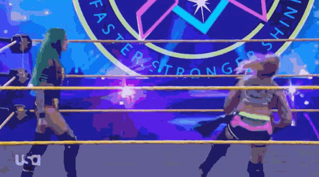 two women in a wrestling ring with a logo that says faster stronger