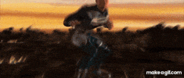 a man in a superhero costume is running in a blurry photo with the website makeagif.com at the bottom