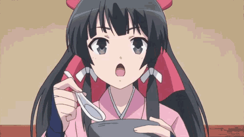 a girl with long black hair is holding a spoon in her hand