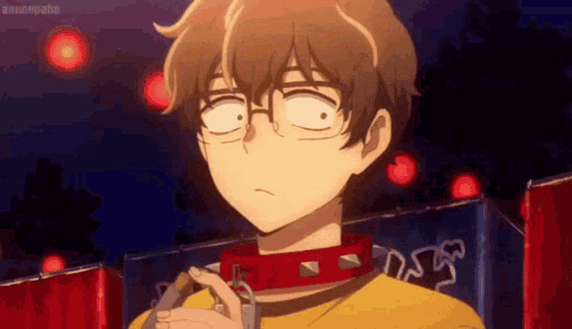 a boy with glasses is wearing a red collar and a yellow shirt .