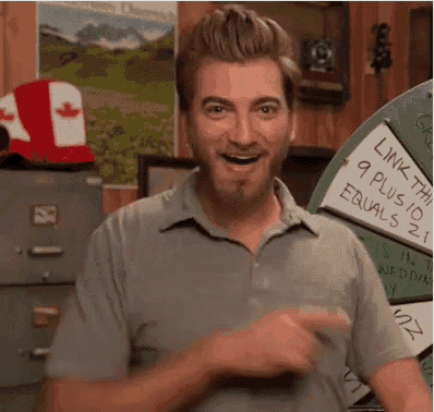 a man is pointing at something in front of a sign that says `` link the 9 plus 10 equals 21 ''