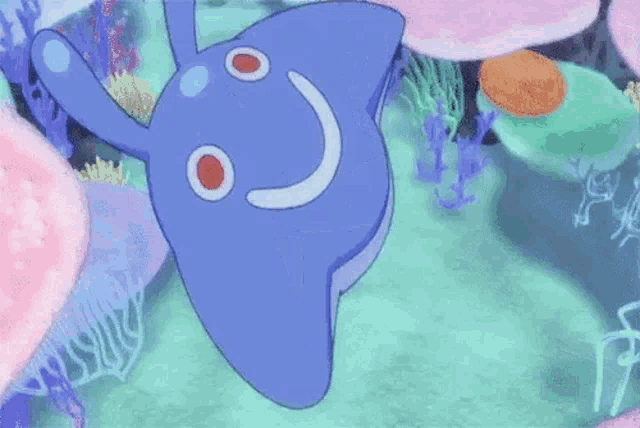 a cartoon dolphin is swimming in the ocean with corals .