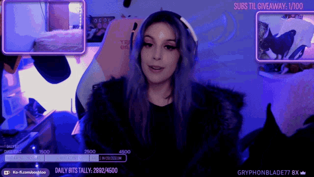 a girl with purple hair is sitting in front of a screen that says subs till giveaway 1/100
