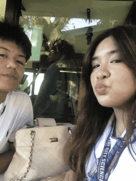 a girl wearing a lanyard that says city science on it