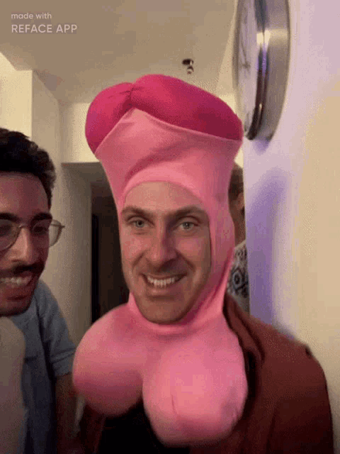 a man wearing a pink costume with a clock behind him that says made with reface app