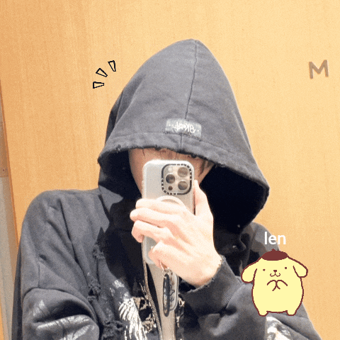 a person wearing a black hoodie taking a selfie