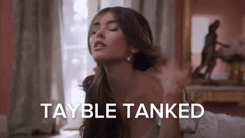 a woman is laying on a bed with her eyes closed and the words tayble tanked written above her