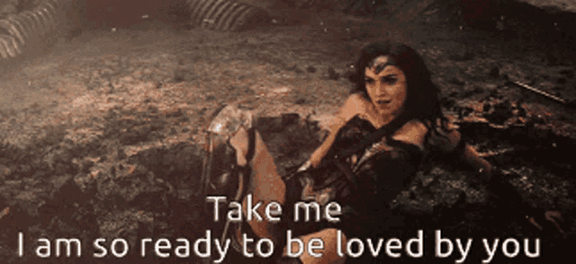 a woman is laying in the dirt with the words take me i am so ready to be loved by you